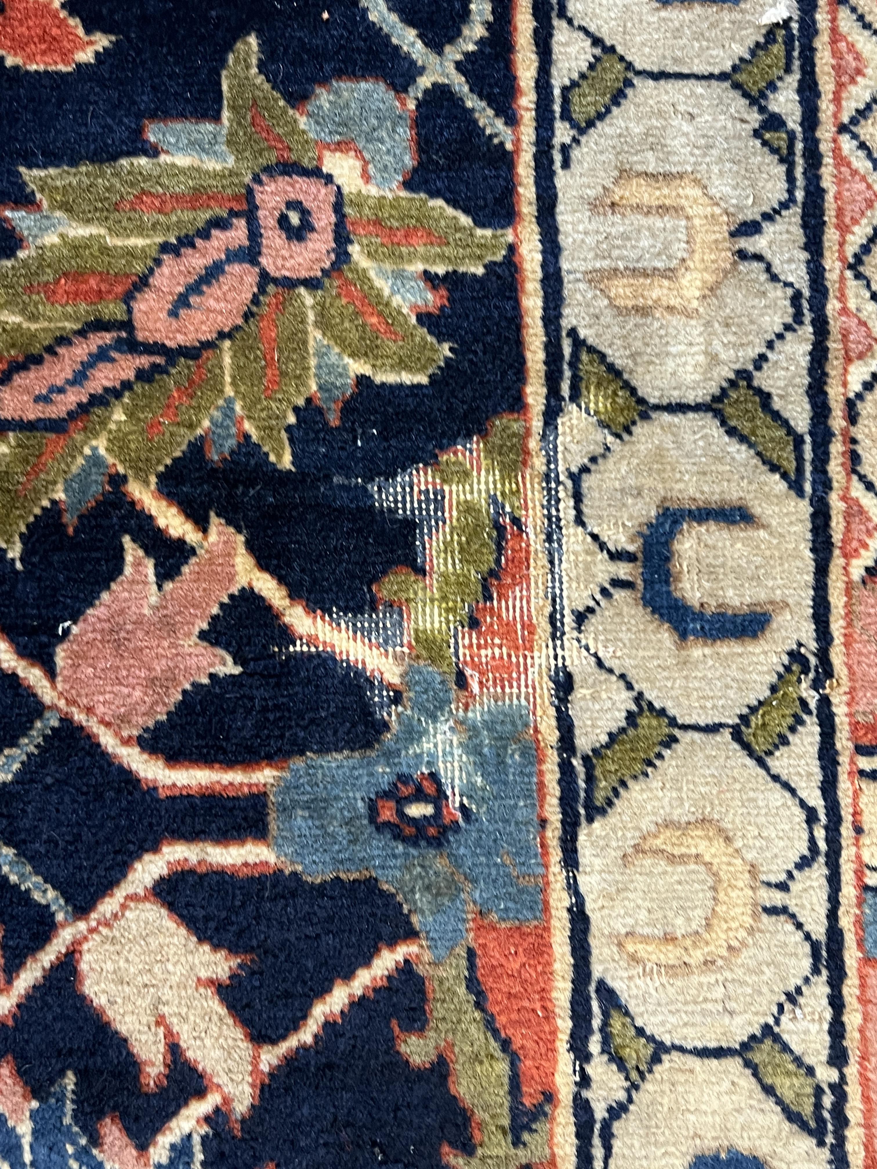 An early 20th century Benlian Tabriz carpet, signed Mahmud, 320 x 225cm